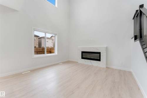 339 Roberts Wynd, Leduc, AB - Indoor Photo Showing Living Room With Fireplace
