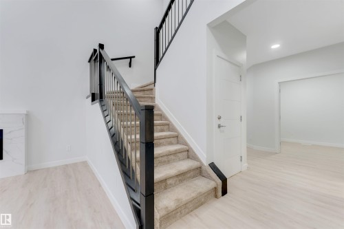 339 Roberts Wynd, Leduc, AB - Indoor Photo Showing Other Room With Fireplace