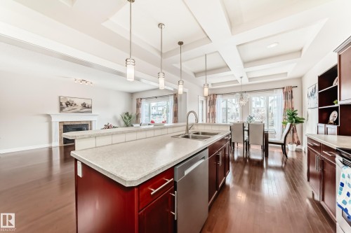 The property features an open concept layout with hardwood flooring throughout - 1330 114B Street, Edmonton, AB - Indoor Photo Showing Kitchen With Double Sink With Upgraded Kitchen