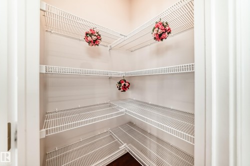 Corner pantry featuring white wire shelving - 1330 114B Street, Edmonton, AB - Indoor With Storage