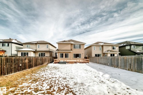 The property includes a spacious yard with a wooden fence and a wooden deck - 1330 114B Street, Edmonton, AB - Outdoor With Exterior
