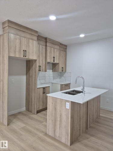 6379 King Wynd, Edmonton, AB - Indoor Photo Showing Kitchen With Double Sink