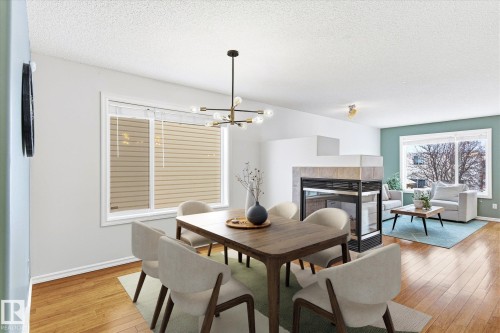 2550 Rabbit Hill Road, Edmonton, AB - Indoor Photo Showing Dining Room With Fireplace
