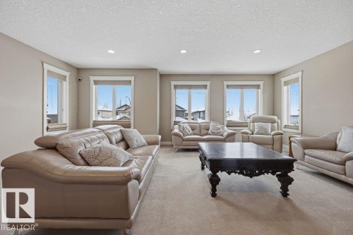 The room features neutral-toned walls and carpeted flooring - 76 Newgate Way, St. Albert, AB - Indoor Photo Showing Living Room