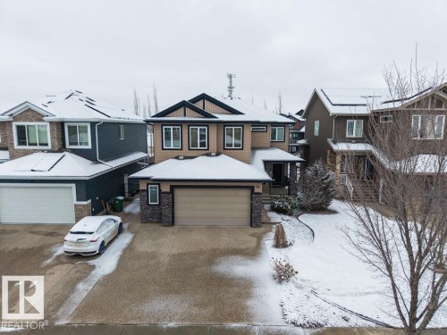 The property features a two-story design with a prominent front-facing garage - 76 Newgate Way, St. Albert, AB - Outdoor With Facade