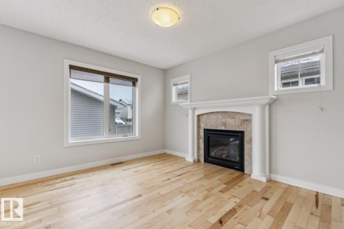 323 Avena Link, Leduc, AB - Indoor Photo Showing Living Room With Fireplace