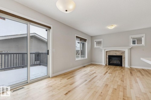323 Avena Link, Leduc, AB - Indoor Photo Showing Living Room With Fireplace
