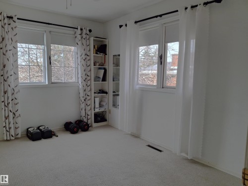 The property features carpeted flooring and multiple windows, providing natural light - 13112 63 Avenue, Edmonton, AB - Indoor