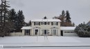 The property features a two-story design with a light-colored exterior and contrasting dark window shutters - 13112 63 Avenue, Edmonton, AB  - Outdoor With Facade 