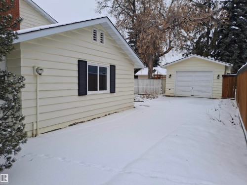 The property features a detached garage and a fenced yard - 13112 63 Avenue, Edmonton, AB - Outdoor With Exterior