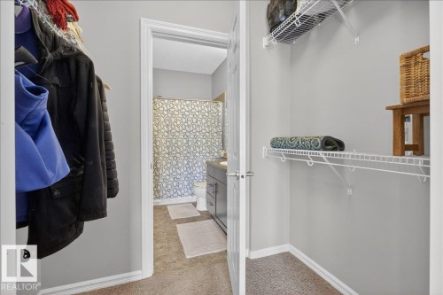 This property features a closet with wire shelving and a hanging rod, providing storage solutions - 413 2203 44 Avenue, Edmonton, AB - Indoor With Storage