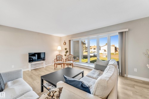 2404 80 Street, Edmonton, AB - Indoor Photo Showing Living Room With Fireplace