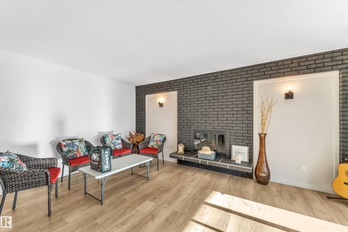 2404 80 Street, Edmonton, AB - Indoor Photo Showing Living Room With Fireplace