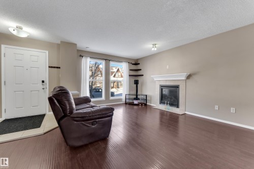 6017 213 Street, Edmonton, AB - Indoor Photo Showing Living Room With Fireplace