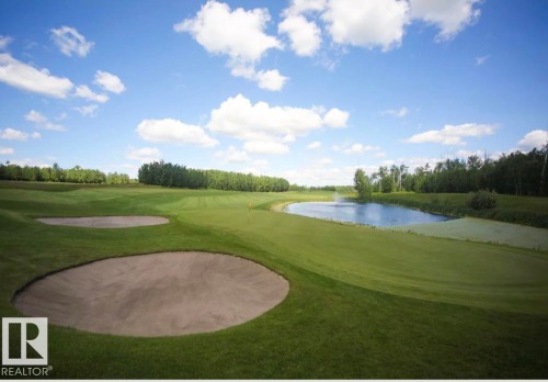 This property features a golf course with sand traps, a green, and a water feature - 1-51025 Range Road 222, Rural Strathcona County, AB 