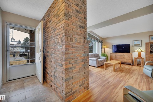 8649 27 Avenue, Edmonton, AB - Indoor Photo Showing Other Room With Fireplace