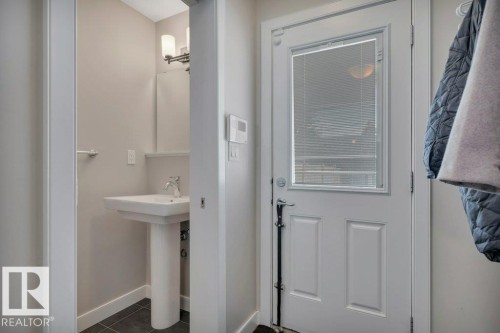 Convenient half bath located of the back door. - 9540 142 Street, Edmonton, AB - Indoor Photo Showing Bathroom