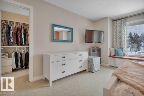 This room features a large walk-in closet with a window. - 9540 142 Street, Edmonton, AB - Indoor