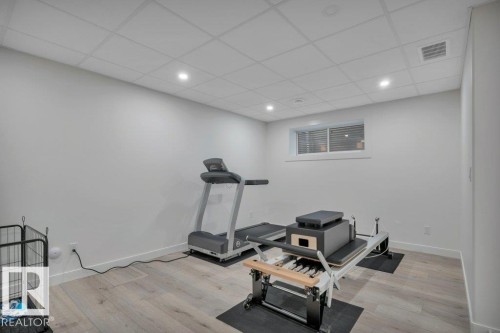 This versatile space allows room for an exercise area. - 9540 142 Street, Edmonton, AB - Indoor Photo Showing Gym Room