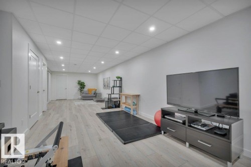 Versatile room featuring light-toned flooring, white walls, and recessed lighting - 9540 142 Street, Edmonton, AB - Indoor