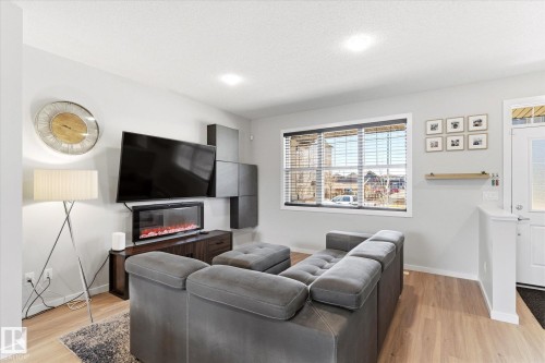 1208 Rosenthal Boulevard, Edmonton, AB - Indoor Photo Showing Living Room With Fireplace
