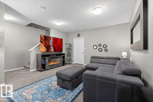 2236 78 Street, Edmonton, AB - Indoor Photo Showing Other Room With Fireplace