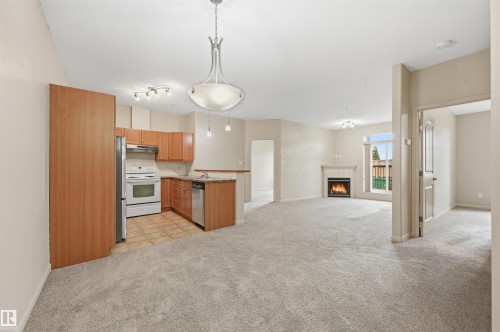139 2503 Hanna Crescent, Edmonton, AB - Indoor Photo Showing Kitchen With Fireplace