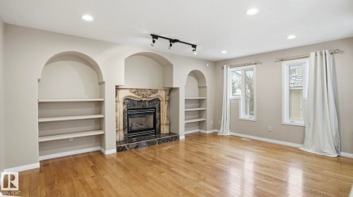 1007 Ormsby Crescent, Edmonton, AB - Indoor Photo Showing Living Room With Fireplace