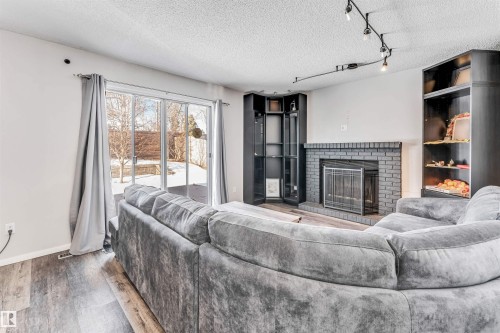 3824 48 Street, Edmonton, AB - Indoor Photo Showing Living Room With Fireplace