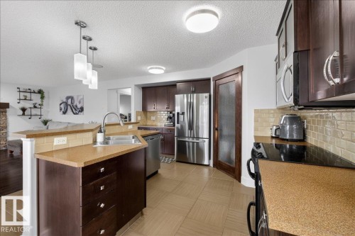 8132 16A Avenue, Edmonton, AB - Indoor Photo Showing Kitchen With Double Sink