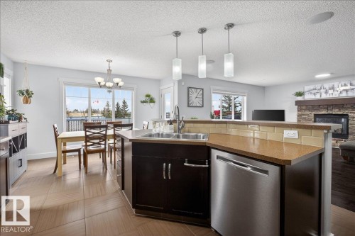 8132 16A Avenue, Edmonton, AB - Indoor Photo Showing Kitchen With Fireplace With Double Sink