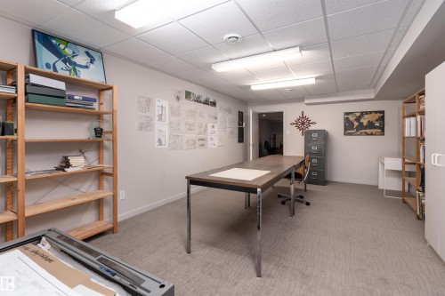 Spacious room featuring carpeting, recessed lighting, and built-in shelving - 9715 141 Street Nw, Edmonton, AB - Indoor