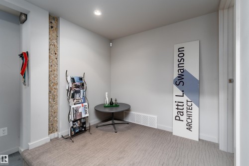 The room features light gray walls, a carpeted floor with a subtle pattern, and a recessed ceiling light - 9715 141 Street Nw, Edmonton, AB - Indoor Photo Showing Other Room