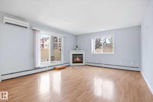 126 10511 42 Avenue, Edmonton, AB - Indoor Photo Showing Living Room With Fireplace