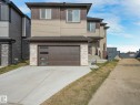 This property features a two-story exterior with horizontal siding and stone accents - 1104 152 Avenue, Edmonton, AB  - Outdoor 