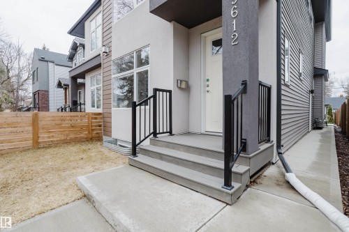 The property features modern exterior finishes including horizontal siding and stucco - 9612 72 Avenue, Edmonton, AB - Outdoor