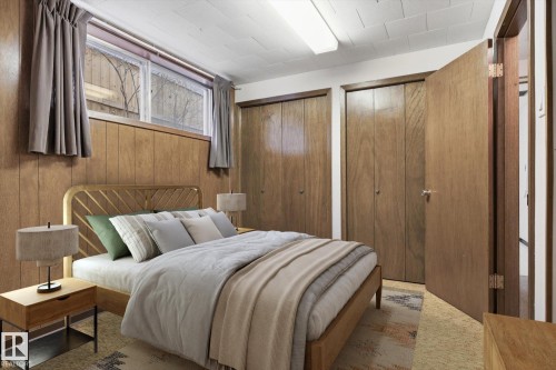 This room features paneled walls and a window with drapes - 9131 74 Street, Edmonton, AB - Indoor Photo Showing Bedroom