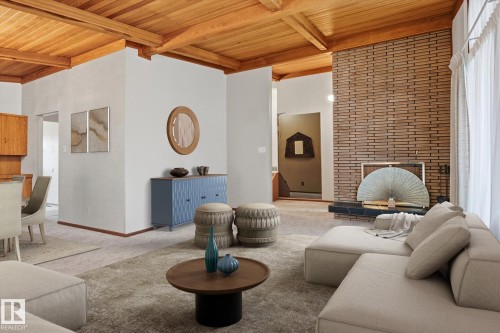 Living area featuring a distinctive wood-beamed ceiling, a brick accent wall with a fireplace, and light-colored carpeting - 9131 74 Street, Edmonton, AB - Indoor Photo Showing Living Room