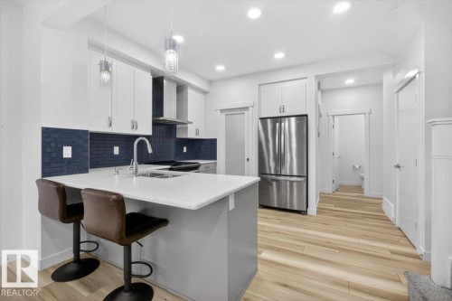 3173 Checknita Way, Edmonton, AB - Indoor Photo Showing Kitchen With Stainless Steel Kitchen With Double Sink With Upgraded Kitchen
