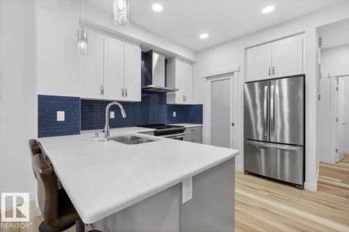 3173 Checknita Way, Edmonton, AB - Indoor Photo Showing Kitchen With Stainless Steel Kitchen With Double Sink With Upgraded Kitchen