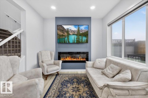 3173 Checknita Way, Edmonton, AB - Indoor Photo Showing Living Room With Fireplace