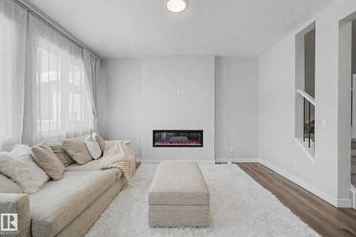 2721 Donaghey Crescent, Edmonton, AB - Indoor Photo Showing Living Room With Fireplace
