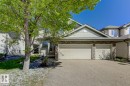 The property features an triple attached garage and an exposed aggregate driveway - 3105 Tredger Place, Edmonton, AB  - Outdoor 