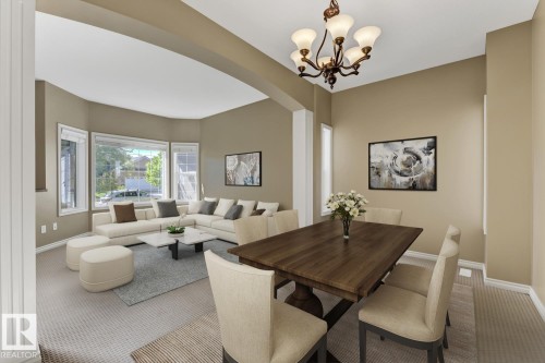 Spacious living area with large windows, neutral-toned walls, and carpeted flooring - 3105 Tredger Place, Edmonton, AB - Indoor Photo Showing Dining Room