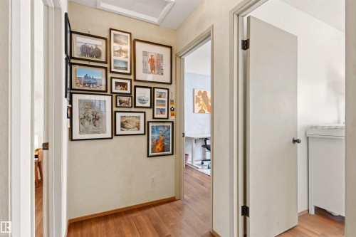 Hallway featuring hardwood floors and neutral-toned walls - 18315 68 Avenue, Edmonton, AB - Indoor Photo Showing Other Room