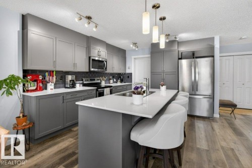 29 Harness Link, Ardrossan, AB - Indoor Photo Showing Kitchen With Stainless Steel Kitchen With Double Sink With Upgraded Kitchen