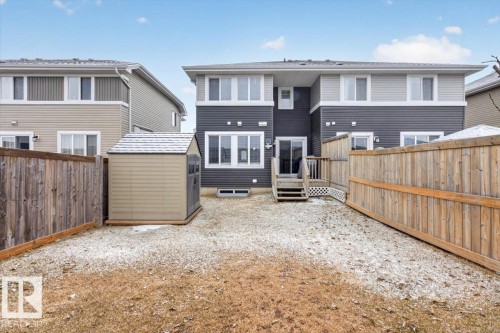 The property features a fenced backyard with a shed for outdoor storage - 16656 14 Avenue, Edmonton, AB - Outdoor