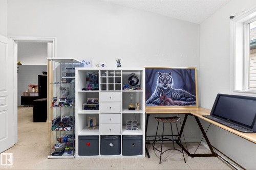 This room features a window providing natural light, white walls, and a vaulted ceiling - 20147 48 Avenue, Edmonton, AB - Indoor