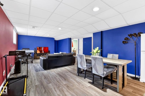The property features durable flooring and recessed lighting, creating a versatile space - 20147 48 Avenue, Edmonton, AB - Indoor Photo Showing Dining Room