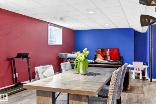 The property features a versatile room with a drop ceiling and recessed lighting, offering ample space for various uses - 20147 48 Avenue, Edmonton, AB - Indoor Photo Showing Dining Room